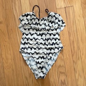This one piece swim suit is absolutely adorable and is very flattering!